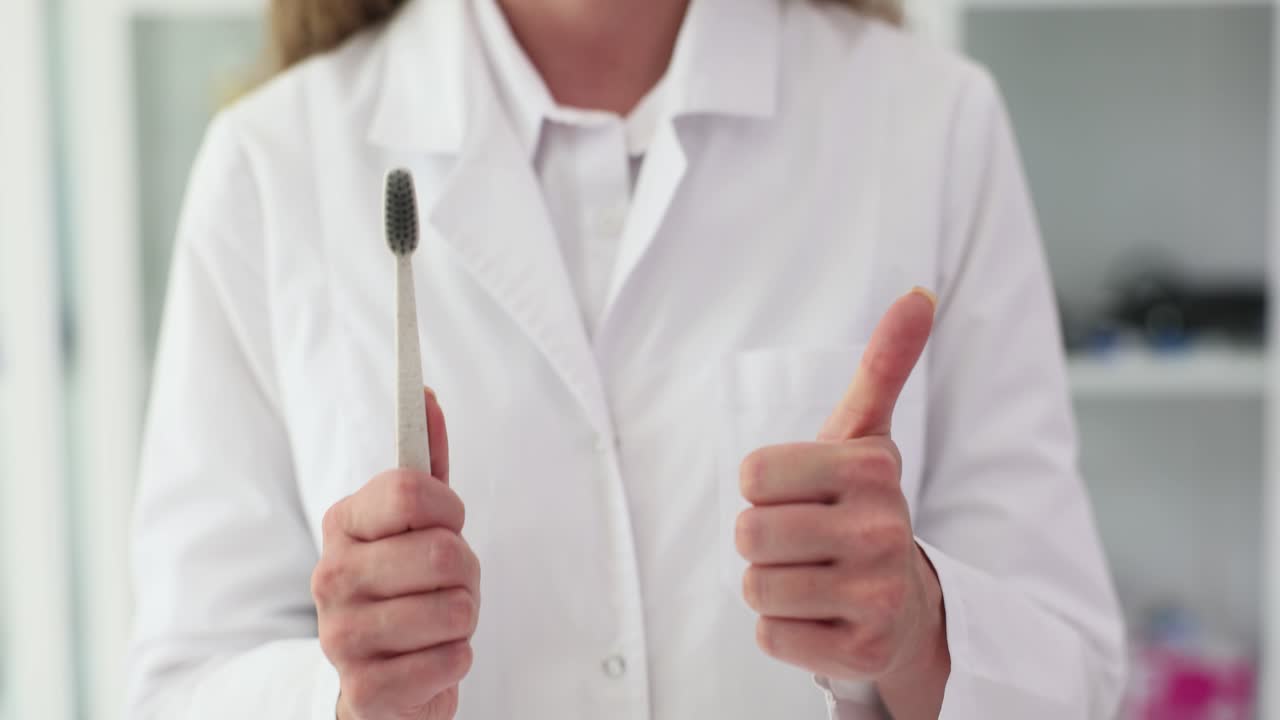 Dentist recommending toothbrush