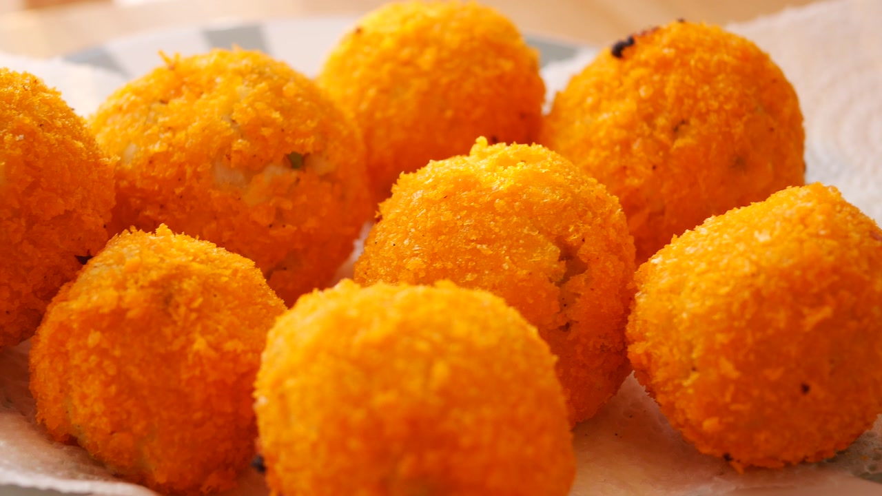 Golden Fried Croquettes Draining Oil on Paper Towel