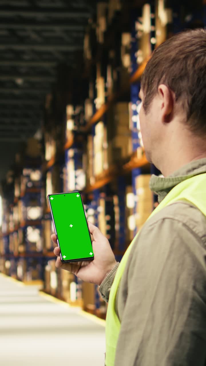 Vertical Video Vertical Screen On Smartphone Held By Male Worker Ensuring Shipment