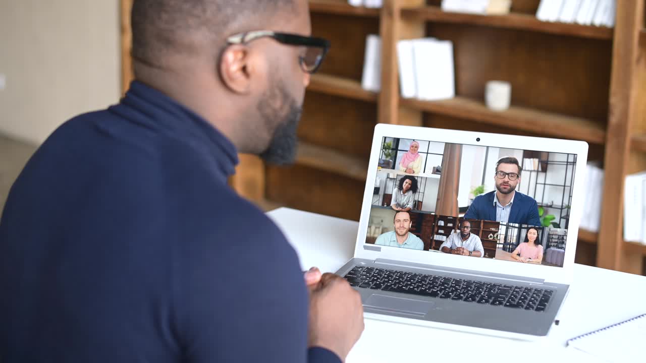 Side view of black businessman talking to his colleagues