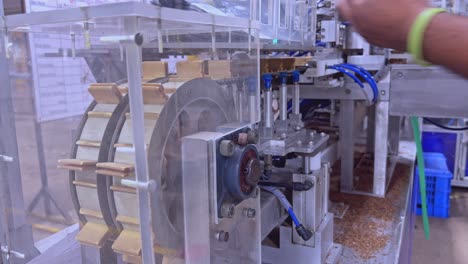 Industrial-process-for-making-cigarettes-and-cigars-in-factory-at-Santiago-de-los-Caballeros,-Dominican-Republic