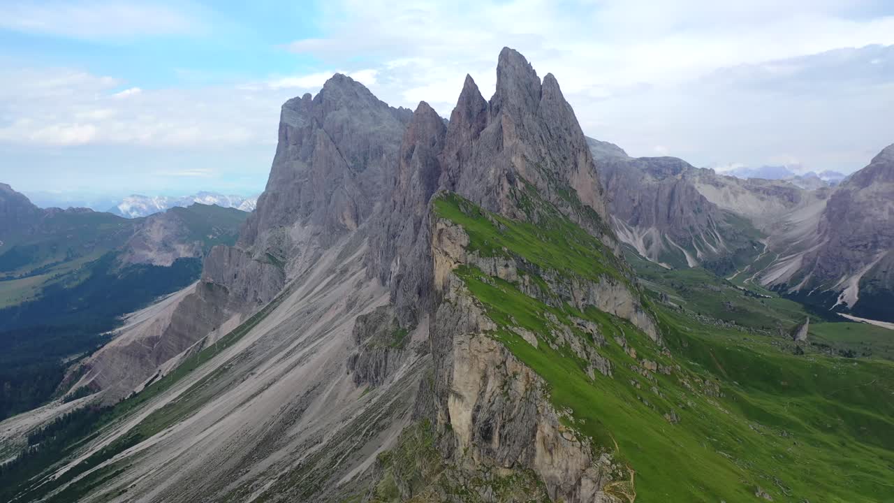 View of Seceda mountain in the Dolomites in summer, aerial circle shot left