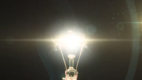 animation of lit light bulb and copy space