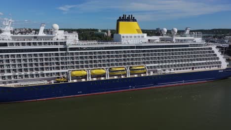 saga cruise ship docked at a port city