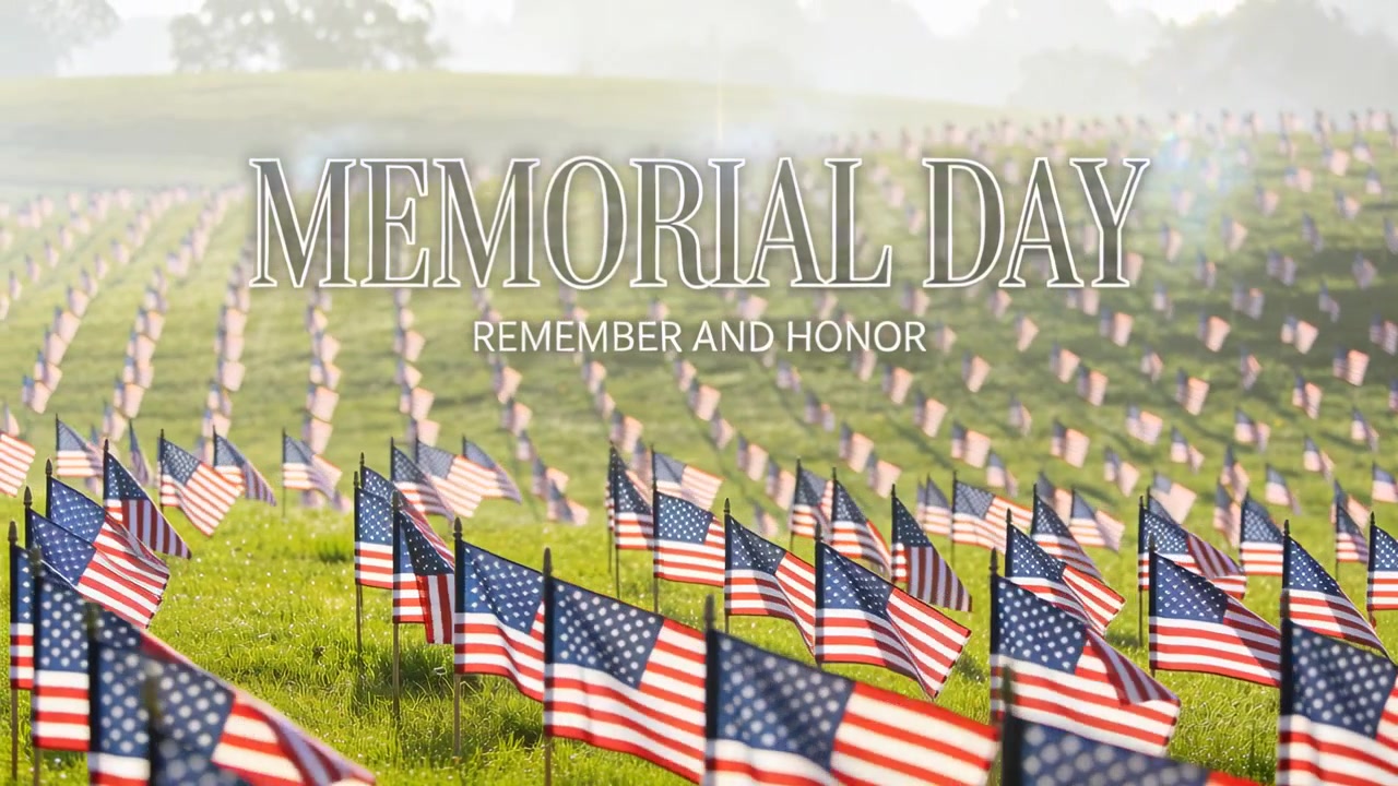 Fluttering US flags shifting in breeze across grassy field, MEMORIAL DAY REMEMBER AND HONOR