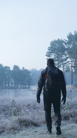 hiker in a foggy winter landscape