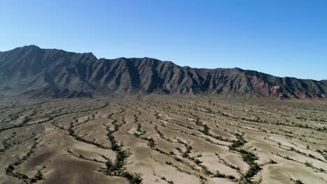 Aerial-view-of-mountains-and-wasteland,-sunny-day-in-Dateland,-Arizona,-USA