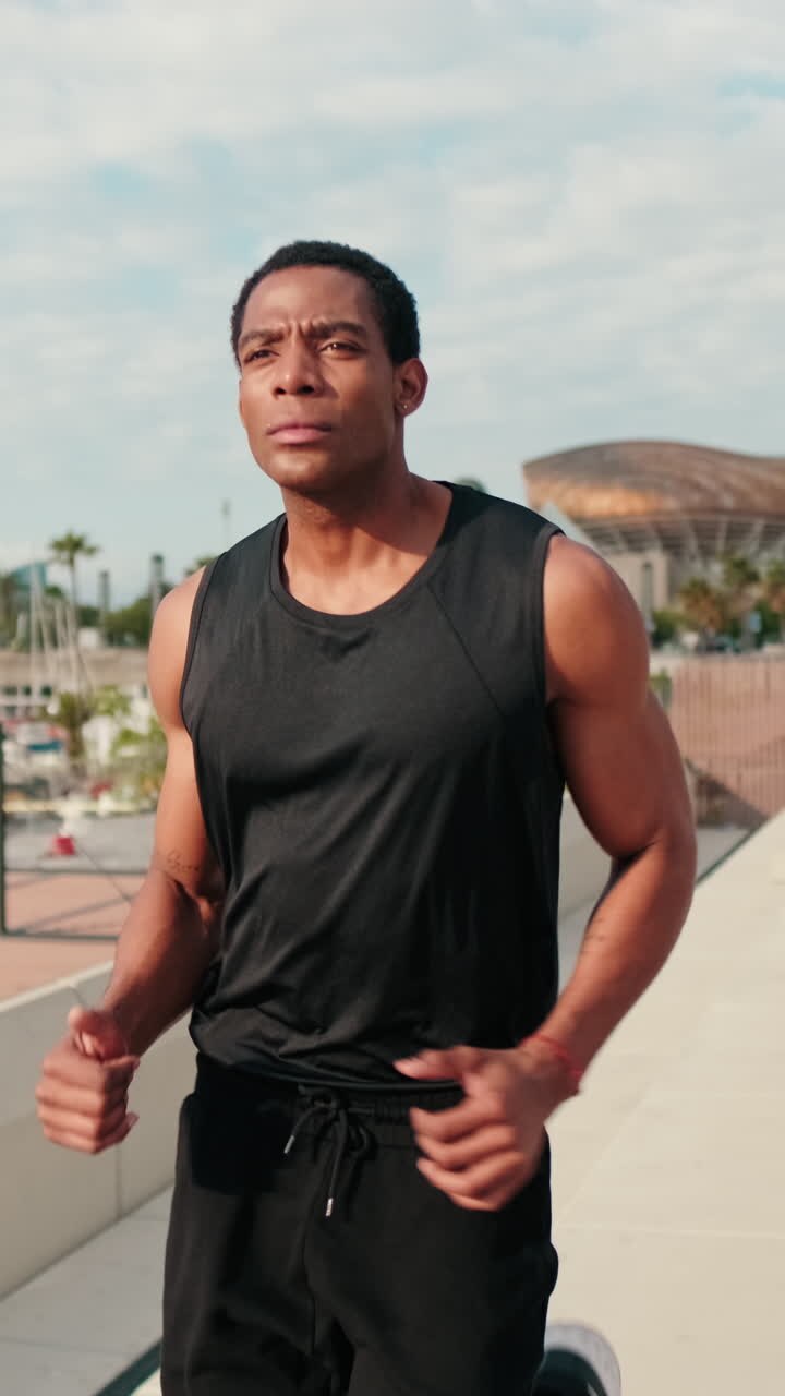 Man Jogging on Boardwalk by Marina