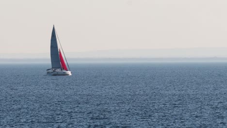 sailboat gliding across calm ocean waters