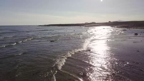 Low-Flight-over-Rare-Golden-Sandy-Beach-and-Ocean-During-Sunny-Summer-In-Snaefellsness-Peninsula,-Iceland