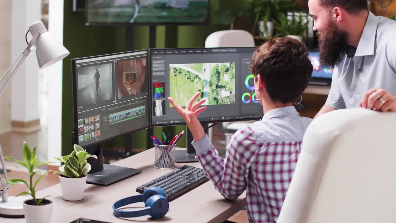 Video editing and color grading session with a team in a professional office