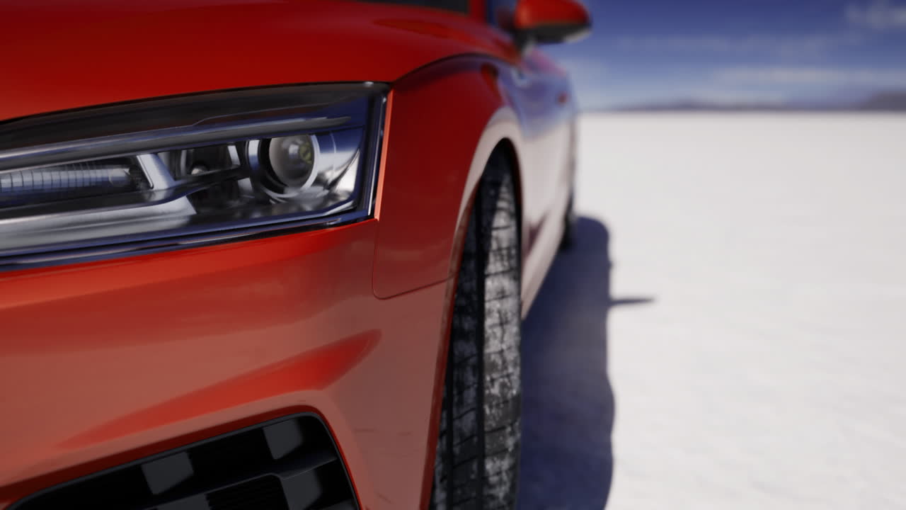 coche rojo brillante estacionado en sal blanca plano con un cielo azul claro