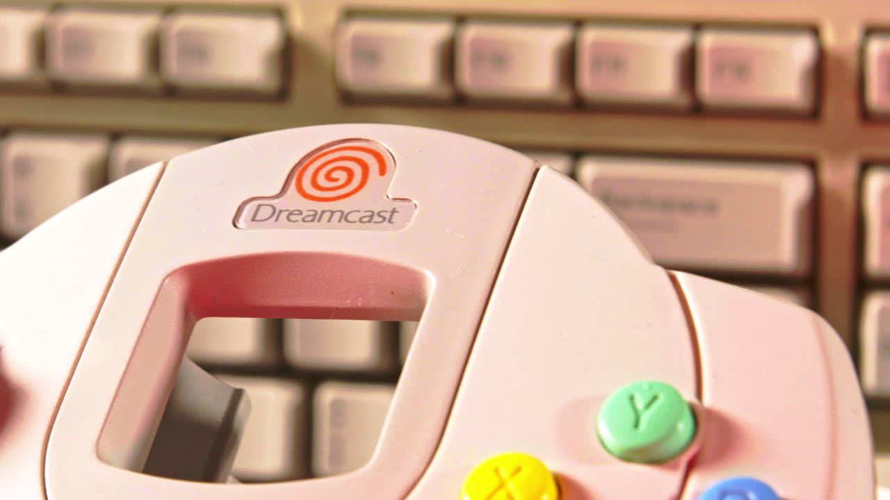 Sega Dreamcast Controller and Console with Keyboard in Background SLIDE RIGHT
