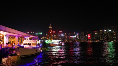 colorful reflections on water at hong kong harbor