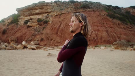 surfer preparing for a session on the beach