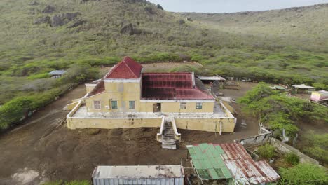 aerial dolly shot of the old plantation complex with neo-classicist building landhuis hermanus from xix century near the sint willibrordus