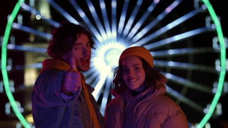 Happy-couple-looking-camera-on-street.-Man-and-woman-enjoying-date-outdoor.