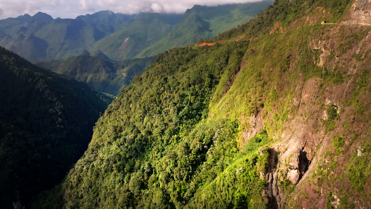 Ha Giang loop, wild mountains in remote and rural landscape, Vietnam. Aerial forward
