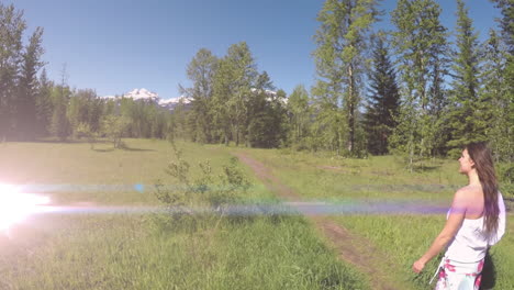 video of lights over caucasian woman walking in nature