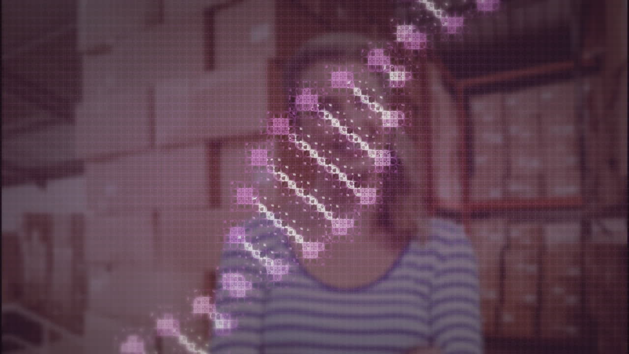 DNA strand animation over person in striped shirt in warehouse setting