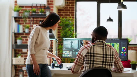 creative interracial couple collaborating on video editing process