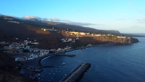 drone hyperlapse or timelapse of coastal town and beach canary island