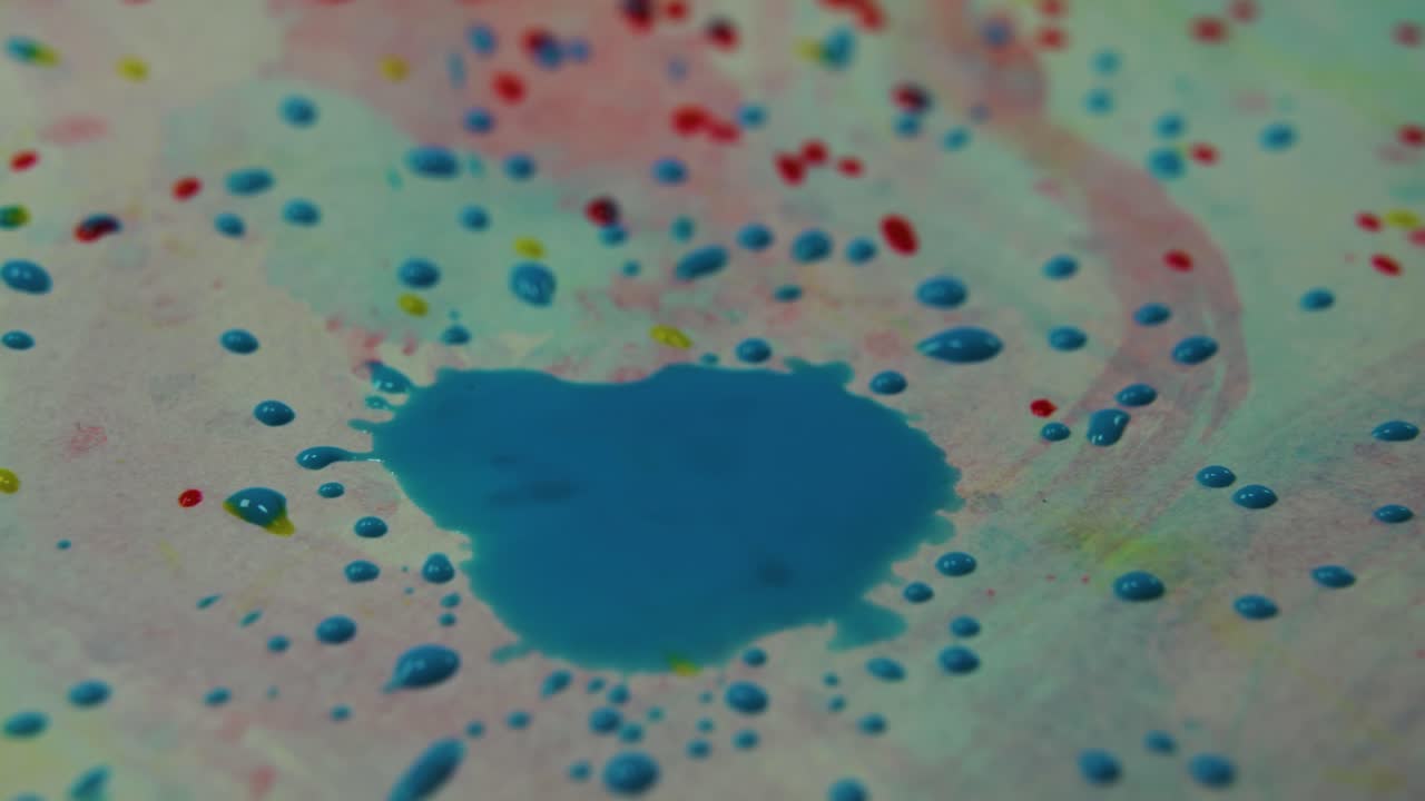 Abstract painting with blue ink drops on colorful draw paper, beautiful texture