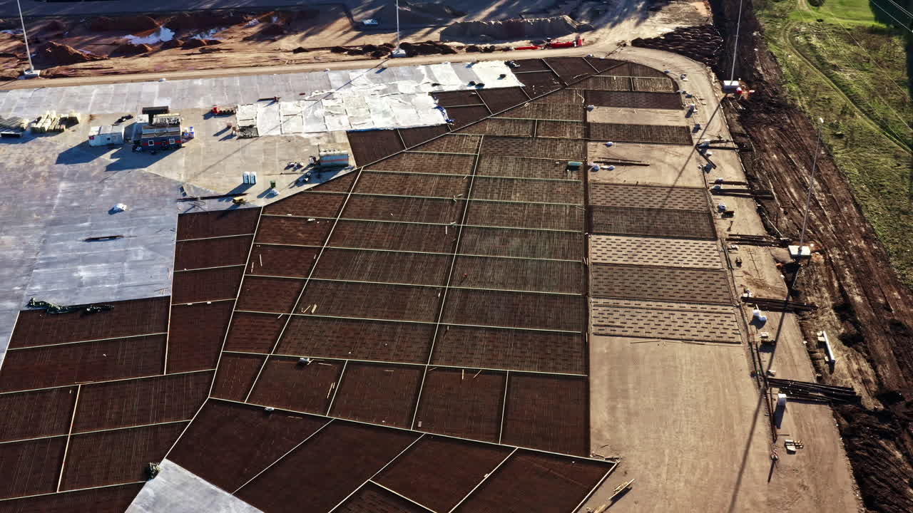Geometric Grid Foundation at Expansive Industrial Site With Sunlight on Golden Hour