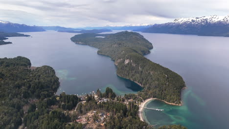 serene aerial drone footage gliding over the lush forests and tranquil beauty of parque nacional arrayanes, capturing stunning natural landscapes in patagonia, argentina.