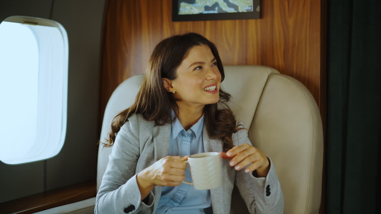 Businesswoman Enjoying Coffee in a Private Jet