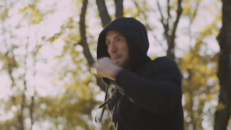 man practicing martial arts in the park