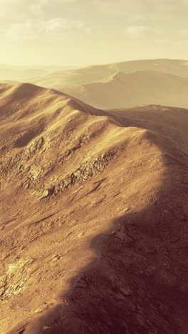 Majestic mountain landscape bathed in warm golden light during sunrise