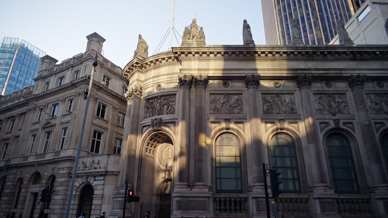 Ornate historic building with Corinthian columns and statues in London's financial district