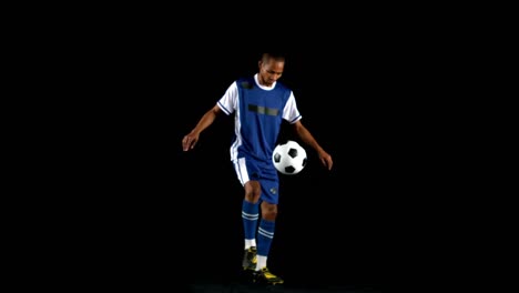 handsome man juggling a football