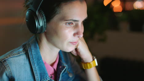 woman working overtime on a laptop in her office