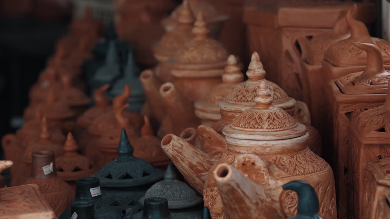 Assortment of Handcrafted Terracotta Pots and Teapots