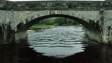 slowly tracking underneath bridge in yorkshire, united kingdom