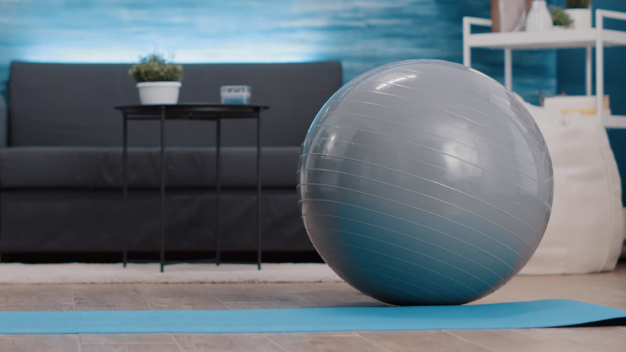 Empty living room with sport and workout equipment