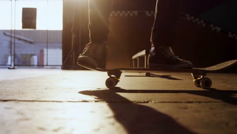 man practicing skateboarding in skateboard arena 4k