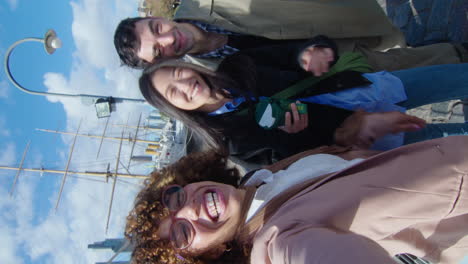 joyous friends chatting on camera outdoors in the city