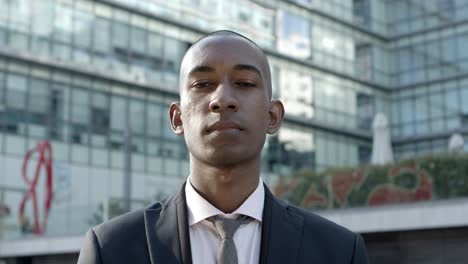 young african american businessman looking at camera