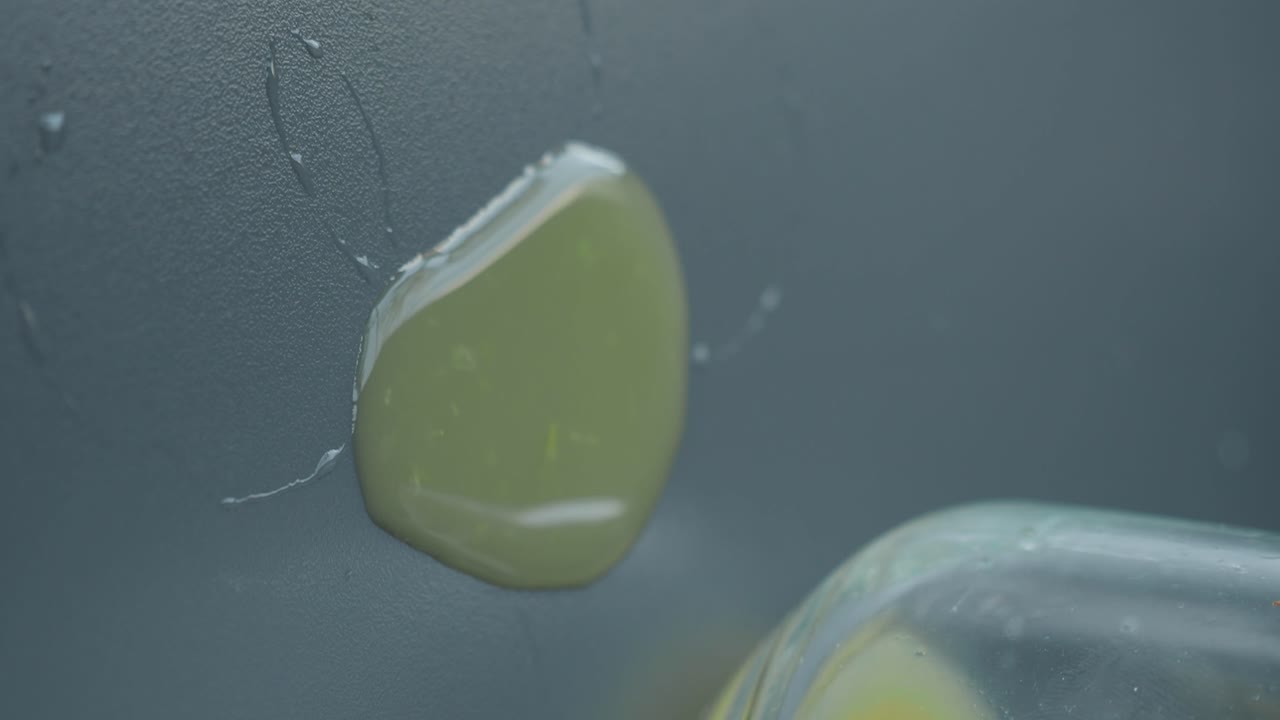 Close-up of a liquid spill on a table