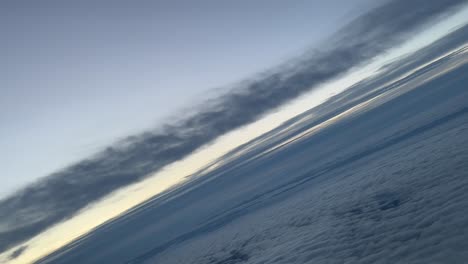 flying across a winter sky during a right turn at dawn, as seen by the pilots, flying at 10000m