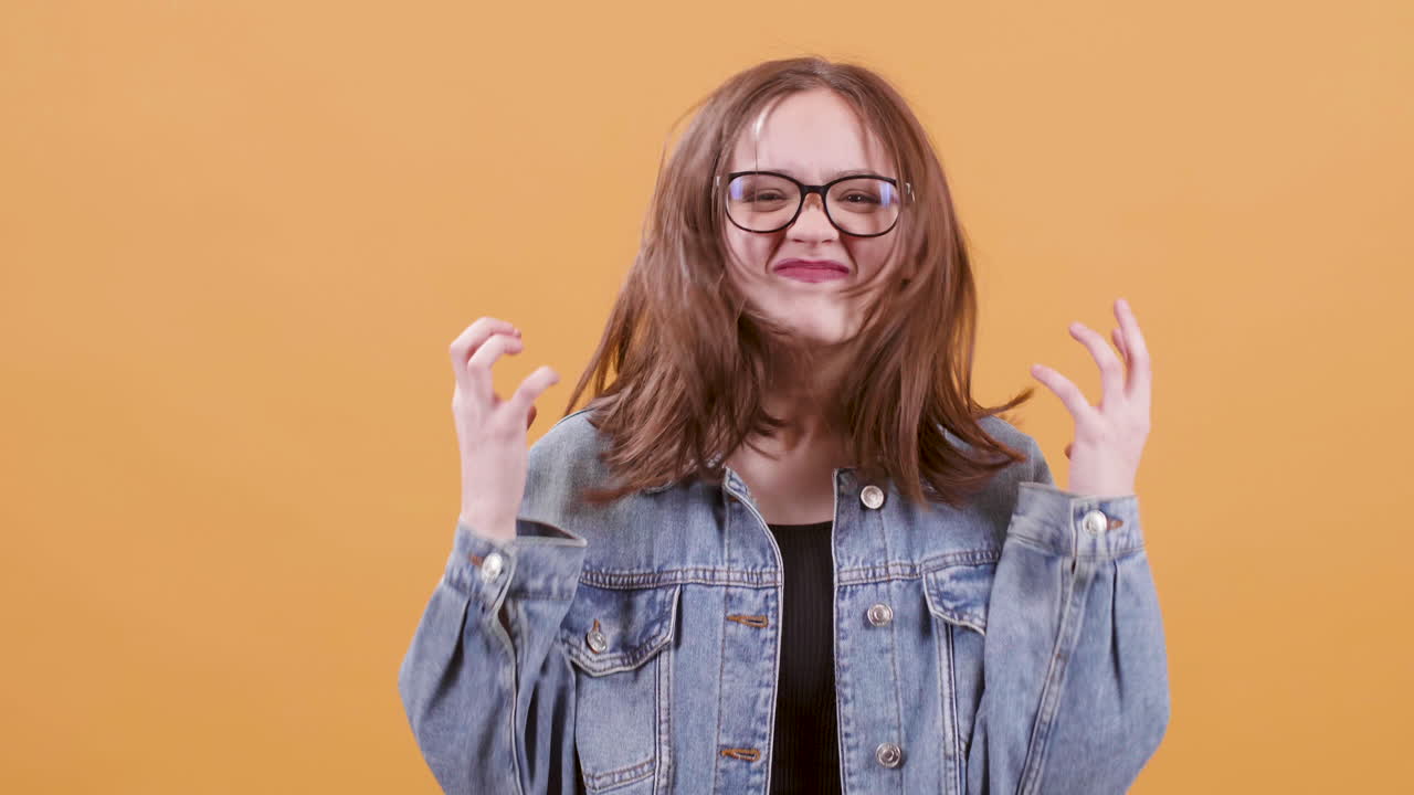 Expressive Young Woman in Denim Jacket
