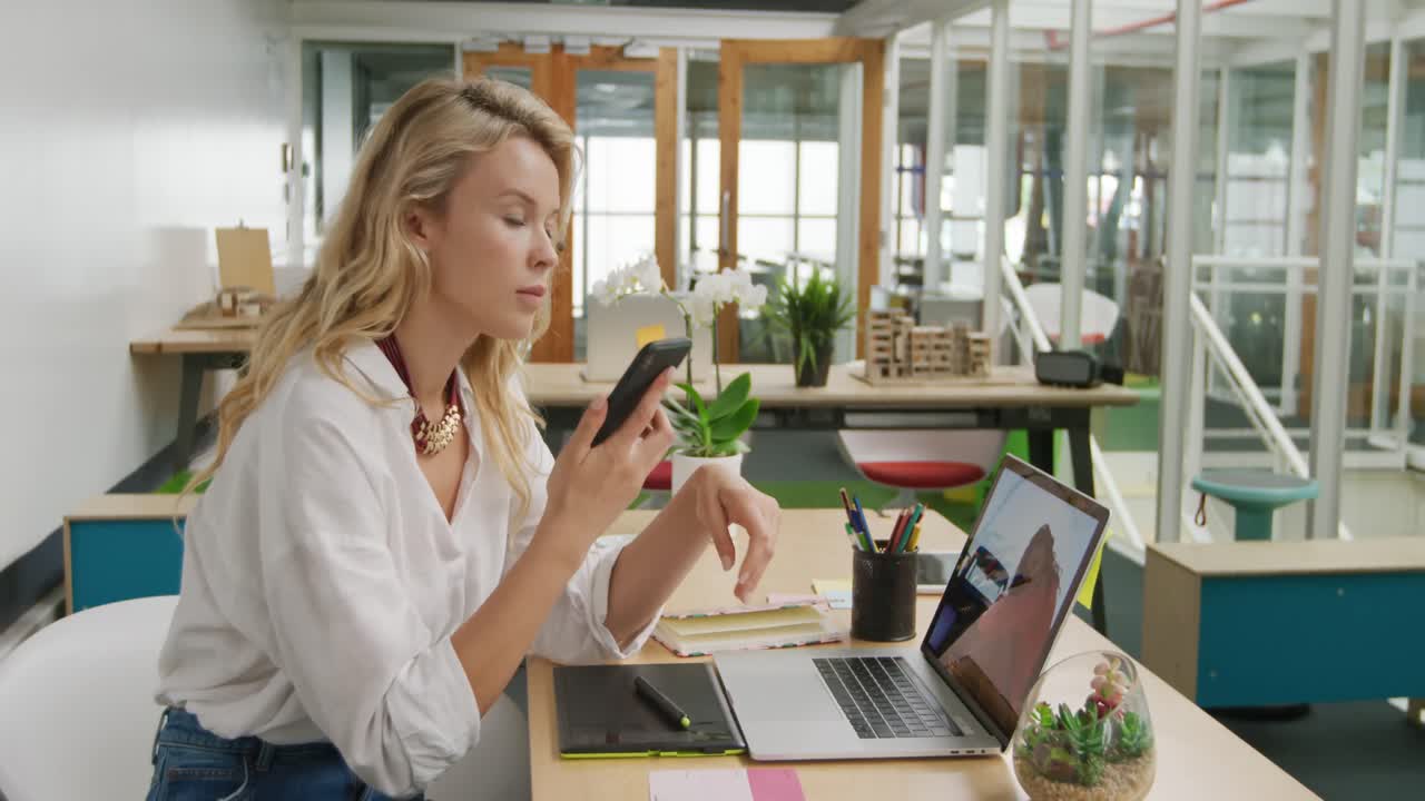 Young woman working in a creative office