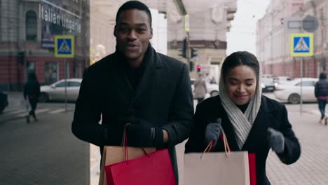 happy couple shopping in the city