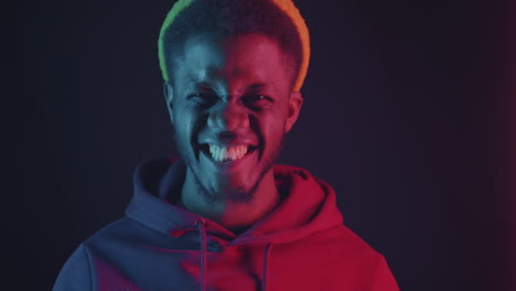 man in neon hoodie