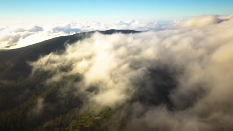 large clouds forming over a village in the european countryside