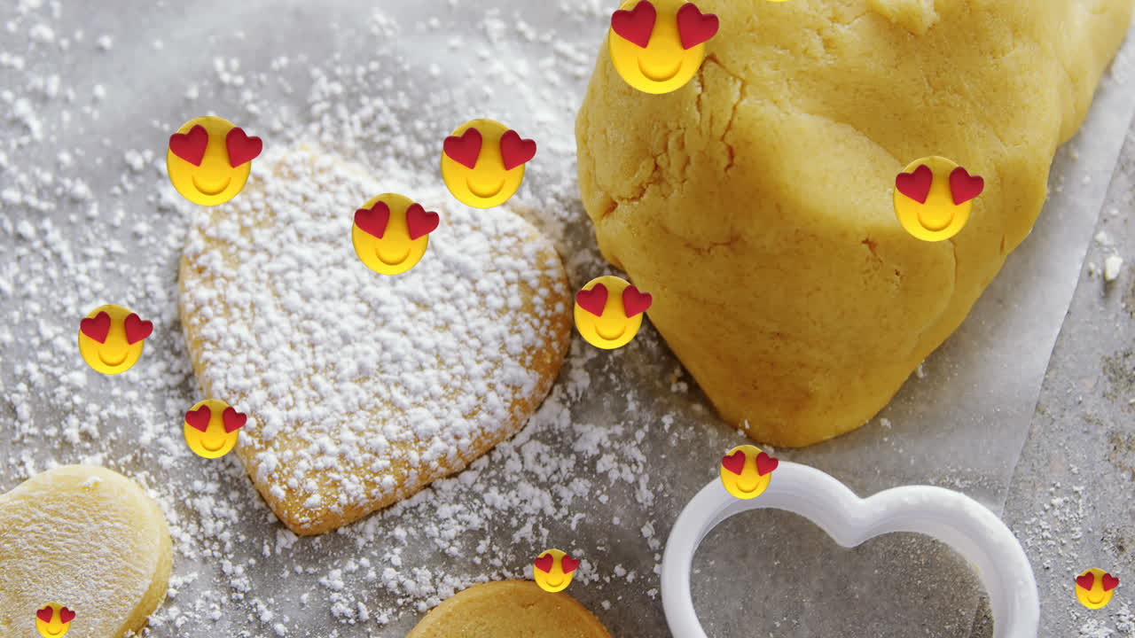 쿠키 반죽과  ⁇ 이 위에 떠다니는 이모티콘의 애니메이션