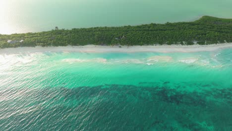 tulum, mexico – aerial drone view of white sand beach and ocean horizon